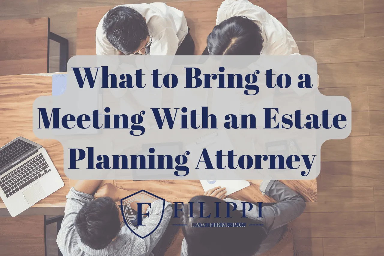 Overhead view of four people sitting around a wooden table with a laptop, documents, and text overlay about estate planning.