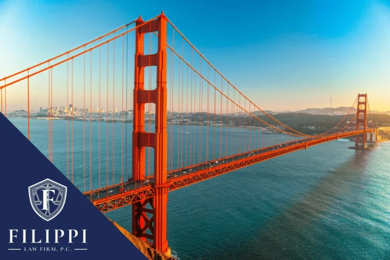 Golden Gate Bridge over water at sunset with Filippi Law Firm logo.