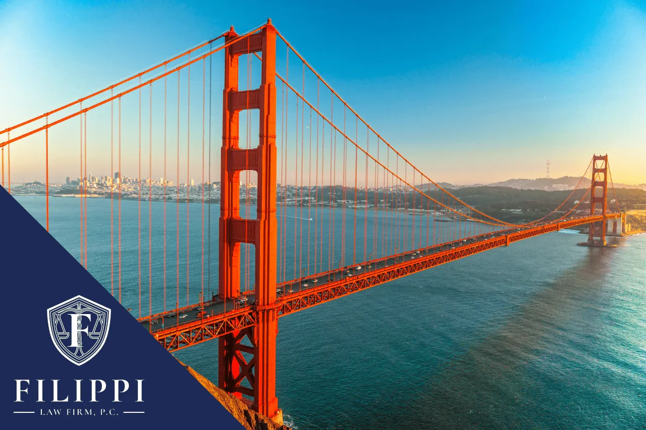 Golden Gate Bridge over water at sunset with Filippi Law Firm logo.