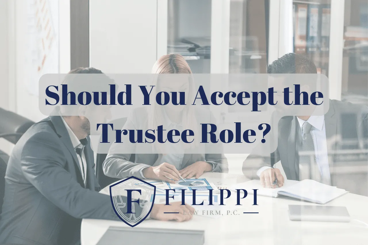 Three business professionals in formal attire seated around a table with text overlay: "Should You Accept the Trustee Role?" and the logo of Filippi Law Firm, P.C.