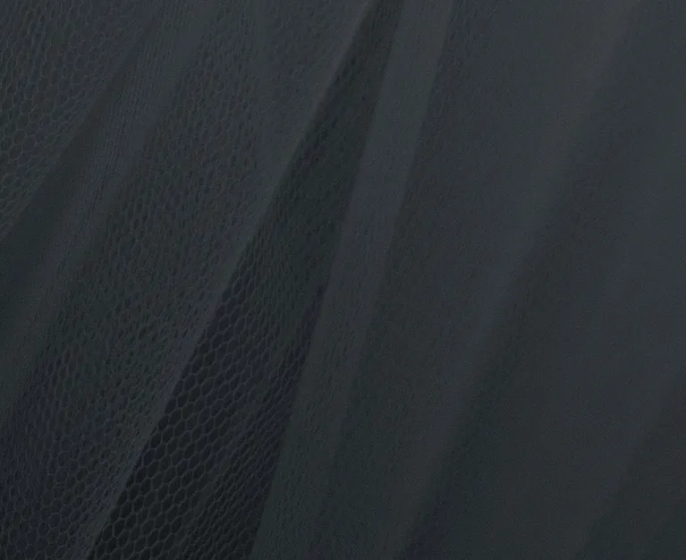 Close-up of dark gray mesh fabric with a subtle honeycomb pattern.