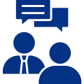 Icon of two blue human figures with overlapping speech bubbles above them.