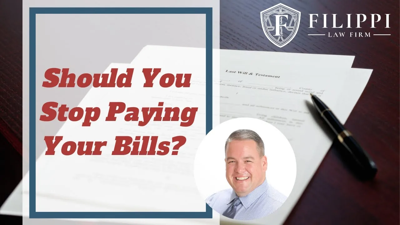 Legal advertisement with text "Should You Stop Paying Your Bills?" over a Last Will & Testament document, pen, and a man's portrait, featuring Filippi Law Firm logo.