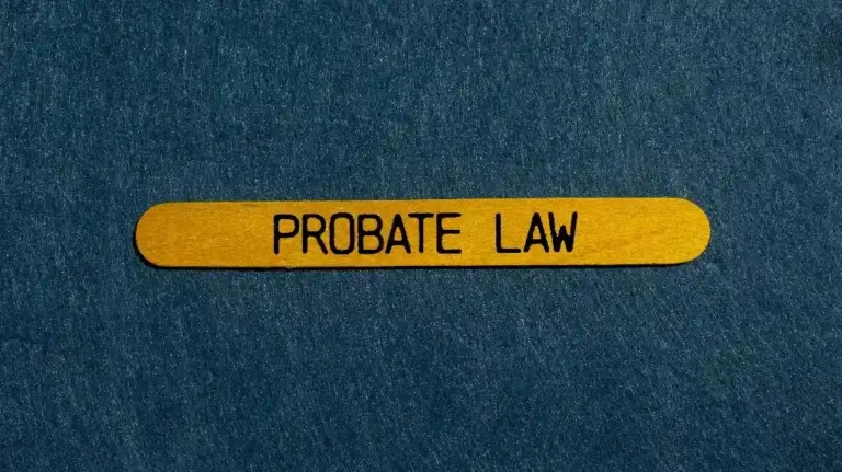 Yellow wooden label with black text "PROBATE LAW" on a textured dark blue background.