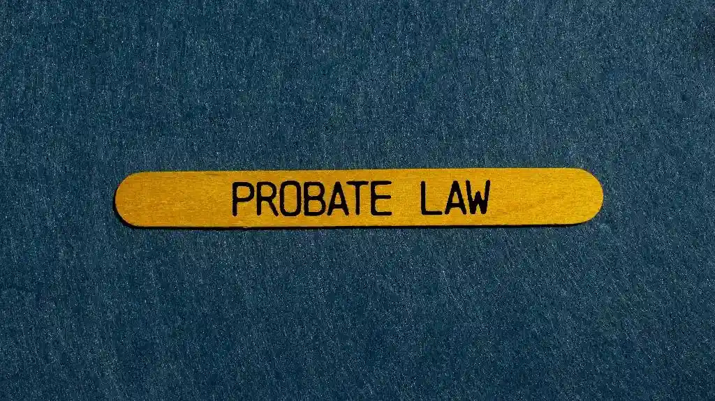 Yellow wooden label with black text "PROBATE LAW" on a textured dark blue background.