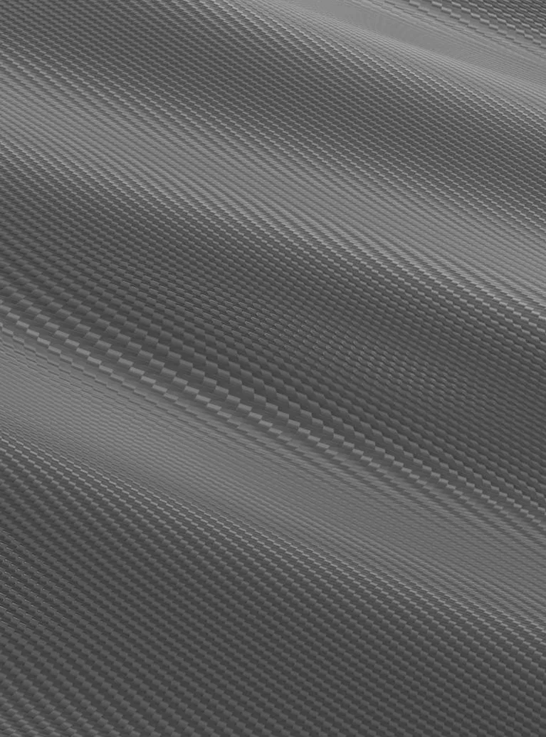 Close-up of black and gray carbon fiber textured surface with diagonal weave pattern.