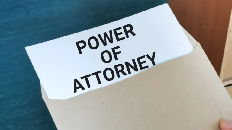 Document labeled "Power of Attorney" partially visible inside a beige envelope.