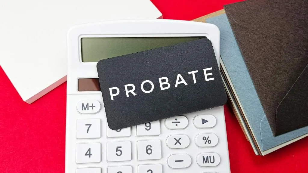 Black card with the word "PROBATE" on white calculator, surrounded by envelopes on red background.